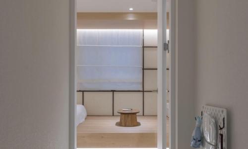 a door leading into a room with a table at Chuncheon Bom Stay in Chuncheon