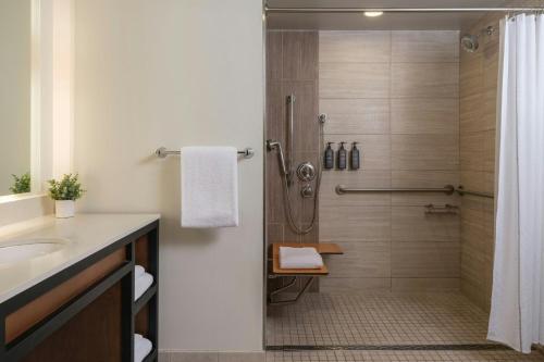 a bathroom with a shower and a sink at Sheraton Steamboat Resort Villas in Steamboat Springs