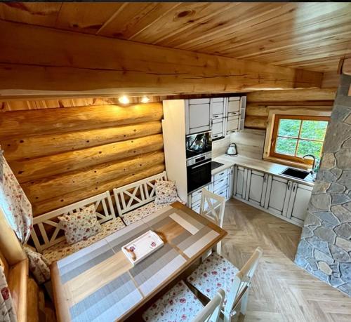 an overhead view of a kitchen and living room of a log cabin at Zrub u Pongrácza v Panoráma Parku in Nezbudská Lúčka