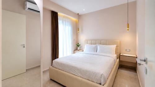 a bedroom with a large bed and a window at Villa Shelegar in (( Metoq ))