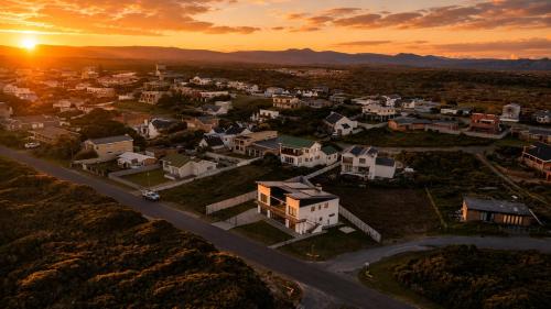 an aerial view of a town at sunset at Sea Mist Villa in Pearly Beach