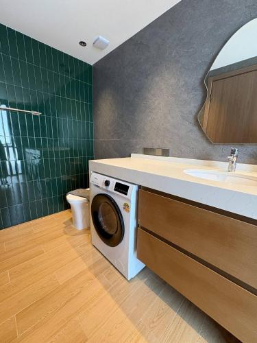 a bathroom with a washing machine and a sink at Villa 7 Ocean View Pool Villa in Bophut