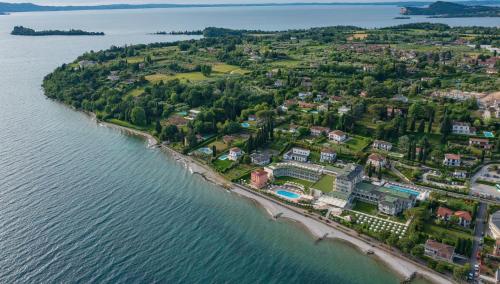 an aerial view of an island in the water at Park Hotel Casimiro in San Felice del Benaco