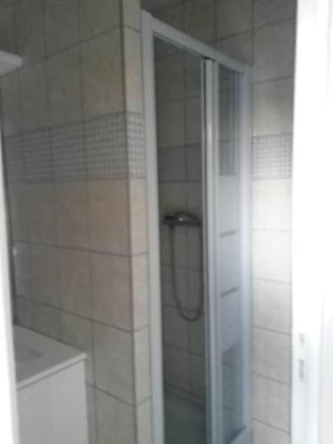 a shower with a glass door in a bathroom at Pavilion - T3 Duplex, avec Terrasse et Parking in Montagnat