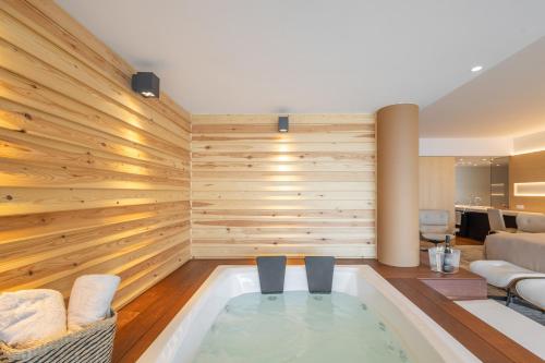 a living room with a jacuzzi tub at Sitges Suites - Premium in Sitges