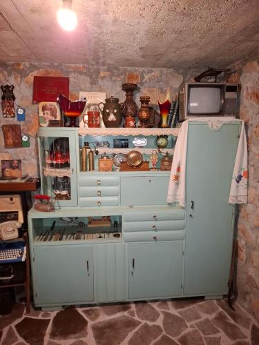 an old refrigerator in a room with a counter at Komani Hideout in Podgorica