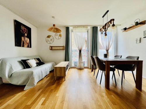 a bedroom with a bed and a table and a desk at Modern 1-Bedroom Retreat in Lausanne