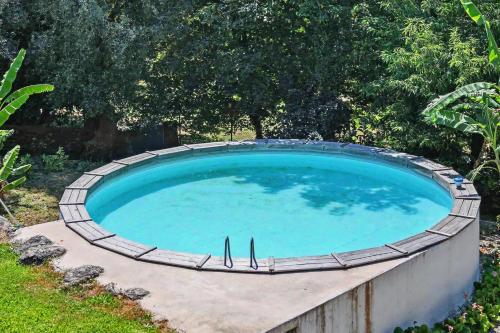 a large pool of water in a yard at Casa Nova das Oliveiras in Verim