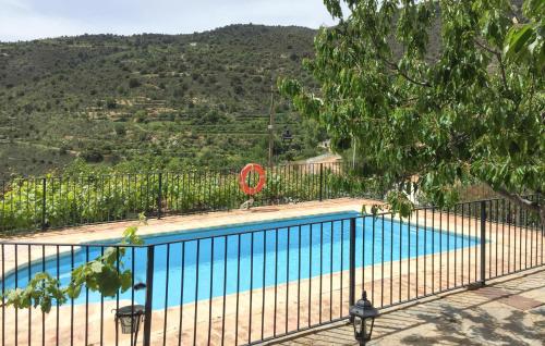 a swimming pool with a view of a mountain at La Curiosa in Laroya