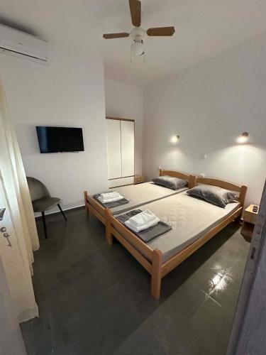 a bedroom with a large bed with a ceiling fan at Sunset Apartment A-4 in Perea