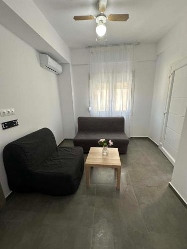 a living room with a couch and a coffee table at Sunset Apartment A-4 in Perea