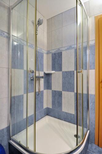 a shower with a glass door in a bathroom at Lavanda Haus in Vodnjan