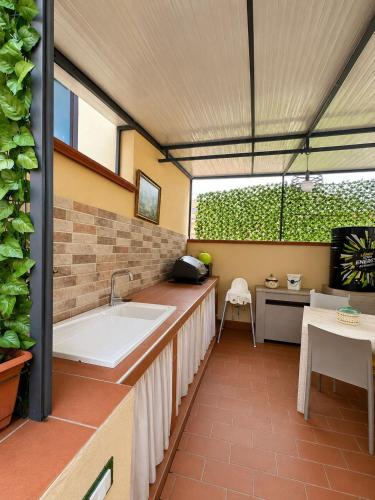 a bathroom with a tub and a table and a sink at Anastasia's House in Palermo