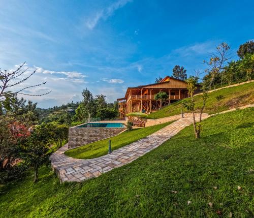 a house on the side of a hill at Umutuzo Lodge Kivu Lake in Buhoro