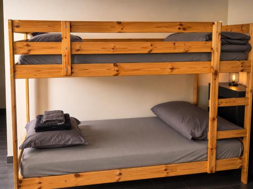 a bunk bed with two pillows on the bottom bunk at Downtown Velvet Loft in Brussels