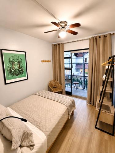 a bedroom with a bed and a ceiling fan at Ayni Living - Hostel in Lima