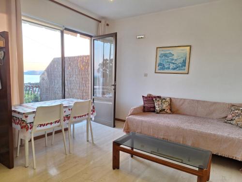 a living room with a couch and a table at LASSI Apartment 2 in Argostoli