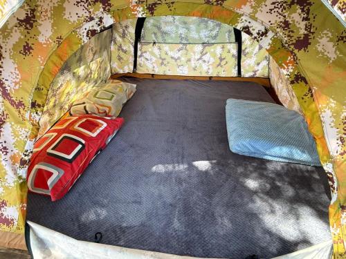 an inside of a tent with a bed in it at Camping Aquariumm in Himare