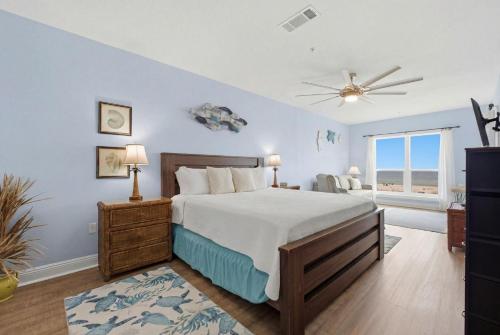 a bedroom with a bed and a ceiling fan at Riviera Dunes 203 in Perdido Key