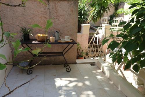 a table sitting on the side of a patio at Boutique Hôtel Azur in Marseille