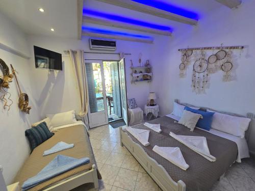 a living room with a bed and a couch at Athina Studios in Chorto