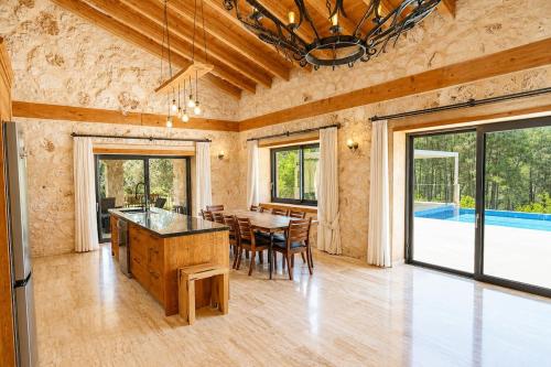 a kitchen and dining room with a table and chairs at Han Villa in Kaş