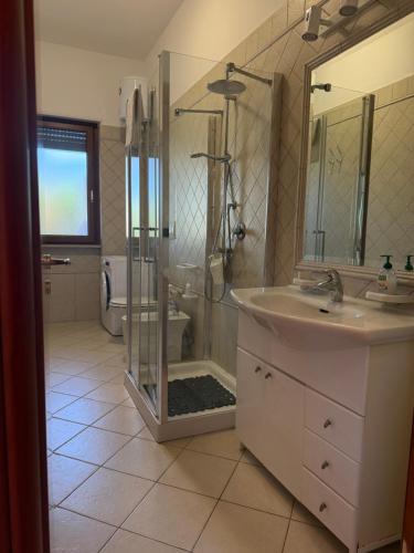 a bathroom with a shower and a sink at Villa Alba fronte mare in Carovigno