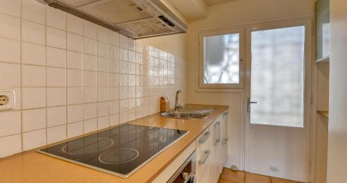 a small kitchen with a sink and a window at Penyagolosa in Calella de Palafrugell