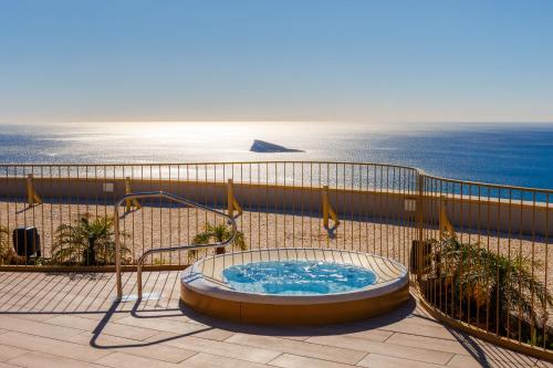 a hot tub on a balcony overlooking the ocean at Intempo by Holuxe - 096 - 9th floor in Benidorm