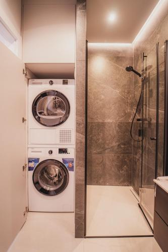 a laundry room with a washer and dryer at NG Apartments in Rzeszów