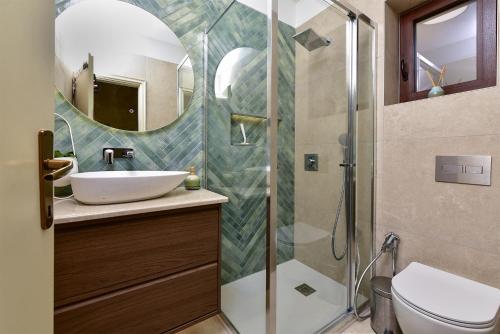 a bathroom with a sink and a shower at Apartment Modrusani 1561 in Žminj