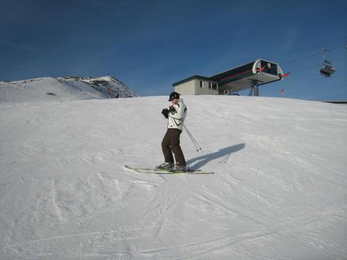 a person is skiing down a snow covered slope at Haus Serena in Sonnenalpe Nassfeld