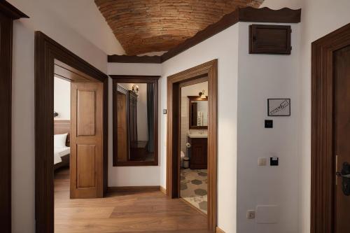 a hallway with two doors and a ceiling at Casa Chitic Hotels in Braşov