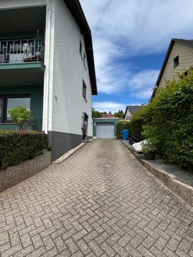 a cobblestone driveway in front of a house at Villa Basilika - Ferienwohnung Prüm in Prüm