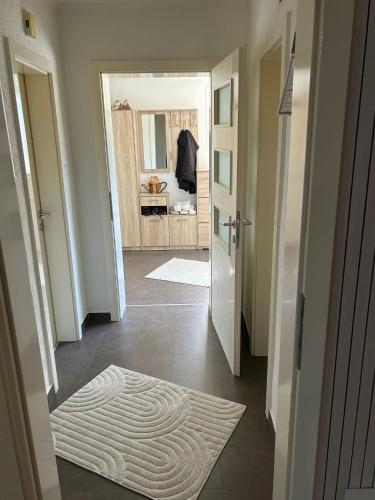 a hallway with a door leading to a bathroom at Home DINA in Ilidža