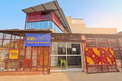 a store front with a sliding glass door at FabHotel Shree Ram Aadhar 900 Mtr from Ram mandir in Ayodhya