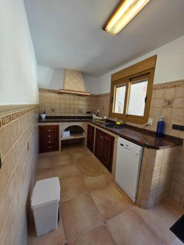 a kitchen with a sink and a dishwasher at Chalet Paradise of the Mediterranean in La Nucía