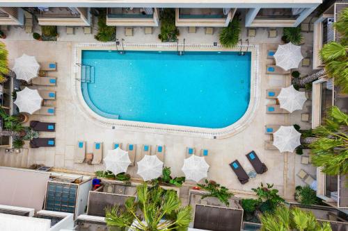 an overhead view of a swimming pool on a building at Pefki Deluxe Residences - Adults Only 16plus in Pefkochori