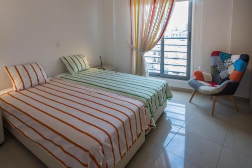 En eller flere senge i et værelse på Skylight Megaron