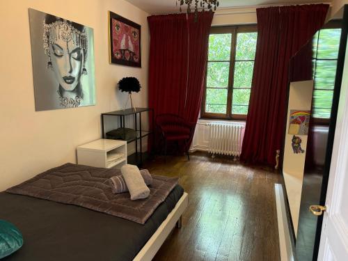 a bedroom with a bed and a large window at Appartement vue lac Montreux in Montreux