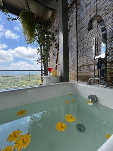 a bath tub with a view of the ocean at Sky Pavilion in Kandy