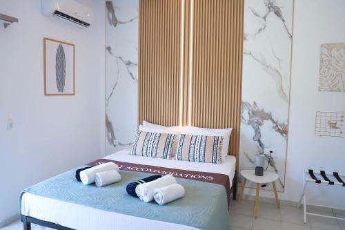 a bedroom with two beds with towels on them at Apartment Simply 302 in Gázion