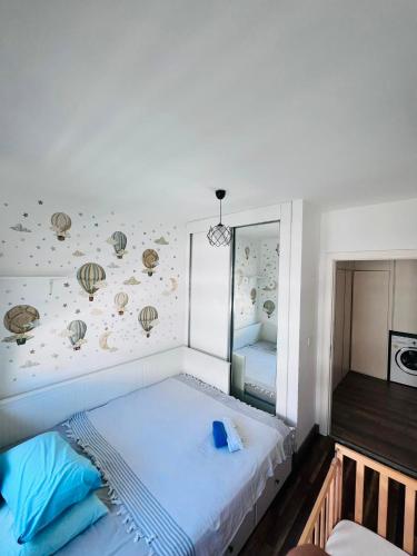 a bedroom with a bed with a wall with shells at Aslan House in Nicosia