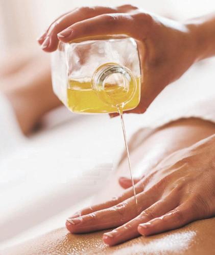 a person is pouring a glass of wine at Kreuz-Post Hotel-Restaurant-SPA in Vogtsburg