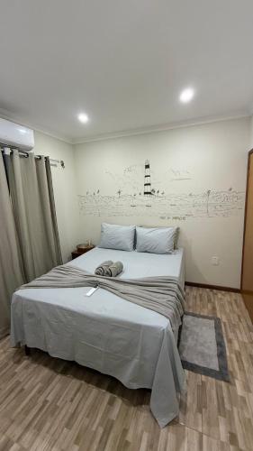 a bedroom with a large bed in a room at Pousada & Hostel América in Barreirinhas