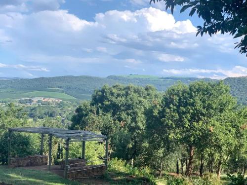 a gazebo on a hill with a view of a valley at Hazyview Accommodation, Bon Repose Cottage 2 in Hazyview