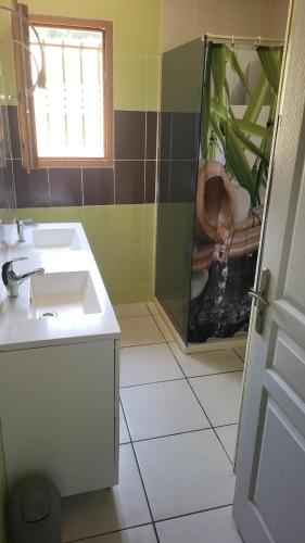 a bathroom with a sink and a toilet and a window at Belle Villa 160 in Blars