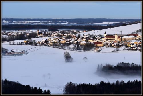 a small town in the snow with houses at Benediktinerstift Michaelbeuern in Michaelbeuern