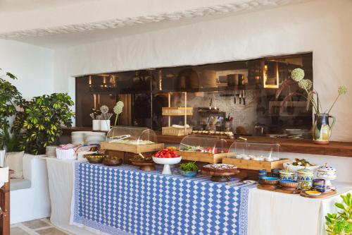 a buffet of food on a table in a kitchen at YAZ Yalıkavak in Yalıkavak