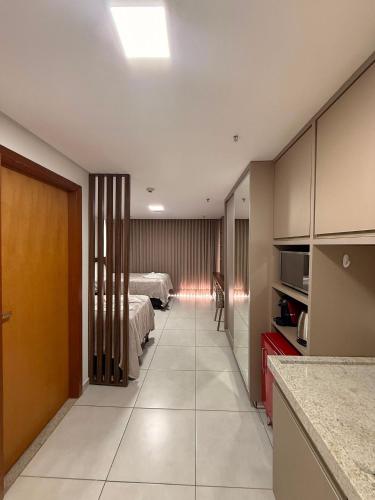 a hallway of a hotel room with a bedroom at AliReserva Luxury Suites in Palmas